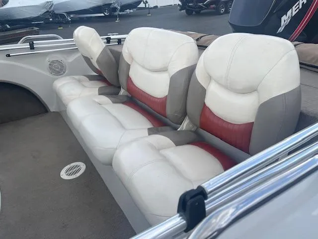 Slide: The Image of 2009 Nitro 189 Sport boat interior with cushioned seating and red accents. - 12