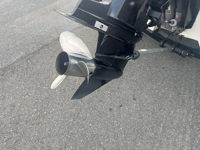 Slide: The Image of Outboard motor propeller of 2009 Nitro 189 Sport boat on pavement. - 8