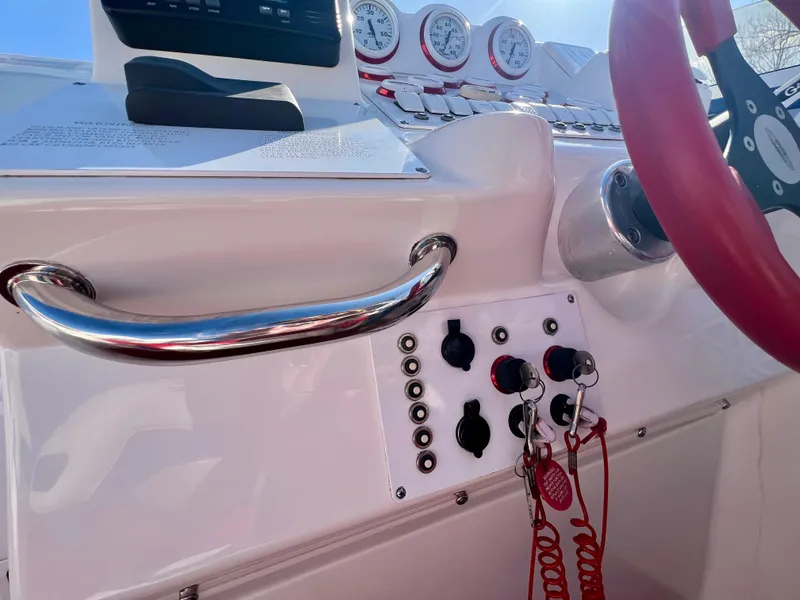 Slide: The Image of 1999 Black Thunder 430 Flat Deck boat dashboard with gauges and controls. - 20