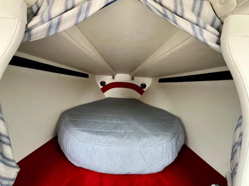 Slide: The Image of Interior cabin of 1999 Black Thunder 430 Flat Deck boat with cozy sleeping area. - 25