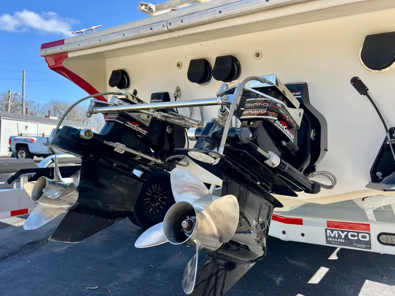 Slide: The Image of 1999 Black Thunder 430 Flat Deck boat with dual propellers and Myco trailer. - 37