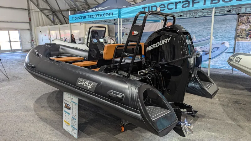 Slide: The Image of 2025 Tide Craft Custom Catalina 13 inflatable boat with Mercury engine on display. - 1