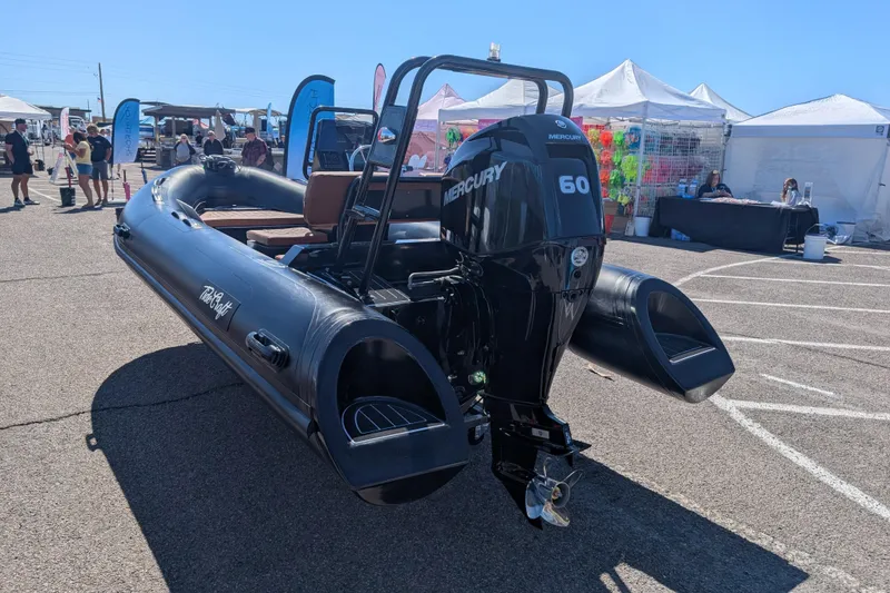 Slide: The Image of Tide Craft Custom Catalina 13 boat, 2025 model, with Mercury 60 engine at outdoor event. - 11