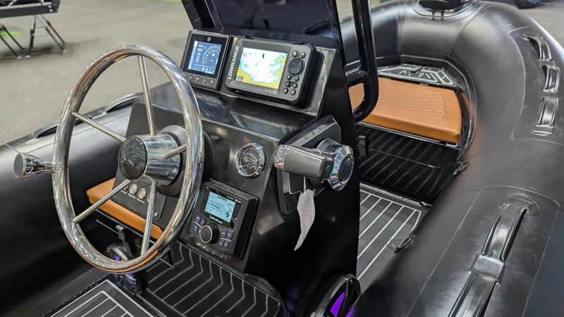 Slide: The Image of 2025 Tide Craft Custom Catalina 13 boat interior with modern navigation and control systems. - 5