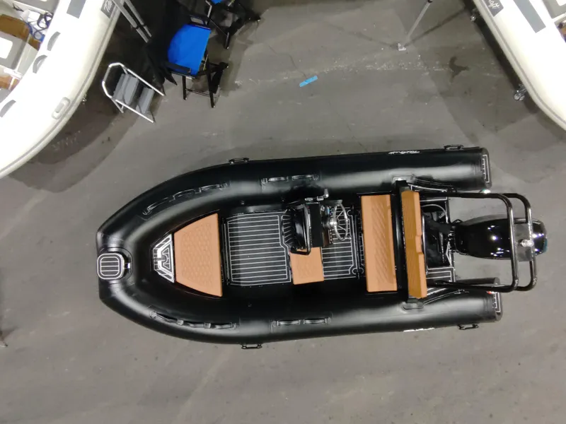 Slide: The Image of 2025 Tide Craft Custom Catalina 13 inflatable boat, top view, black with wooden accents. - 6