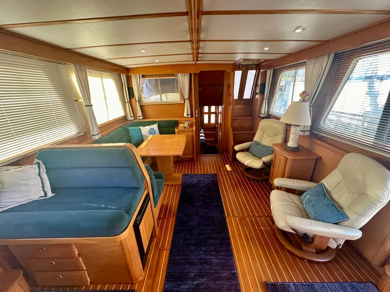 Slide: The Image of Interior of 1997 Sabre Cockpit Motor Yacht with cozy seating and wooden finishes. - 10