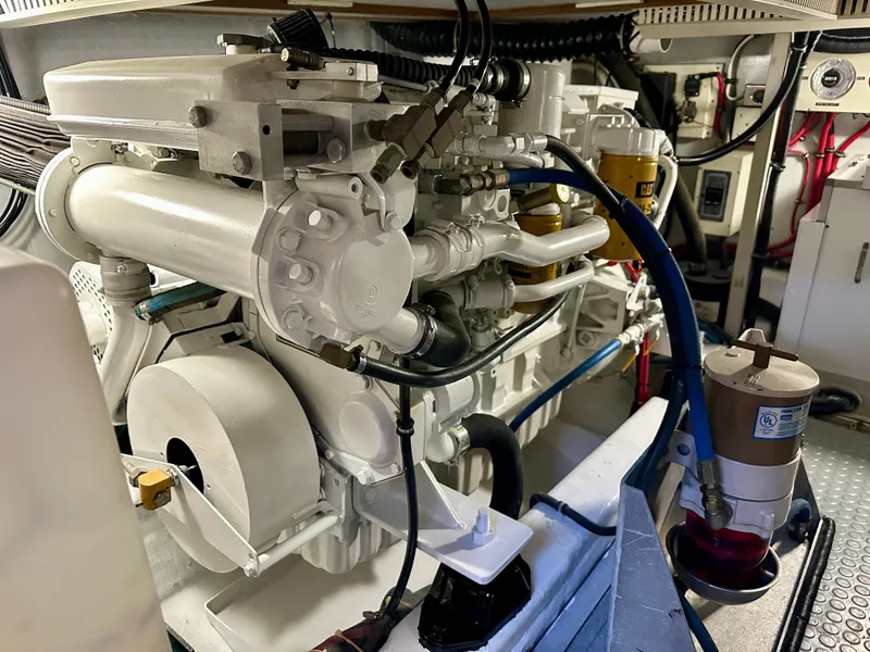 Slide: The Image of Engine room of a 1997 Sabre Cockpit Motor Yacht, showcasing detailed machinery and components. - 33