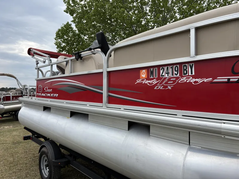 Slide: The Image of 2017 Sun Tracker Party Barge 18 DLX pontoon boat on trailer. - 9