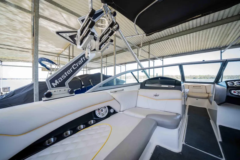 Slide: The Image of 2010 MasterCraft X25 boat interior with sleek seating and advanced controls. - 15