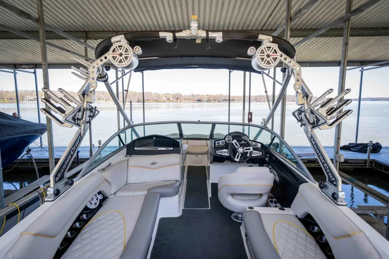 Slide: The Image of 2010 MasterCraft X25 boat interior with modern seating and advanced controls. - 17