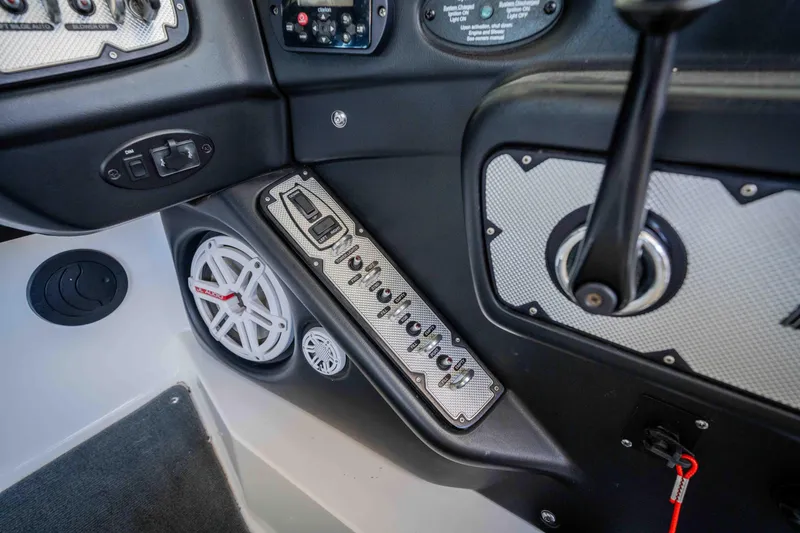 Slide: The Image of 2010 MasterCraft X25 boat dashboard with control panel and speaker system. - 21