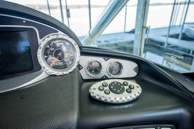 Slide: The Image of Dashboard of 2010 MasterCraft X25 boat with gauges and controls. - 23