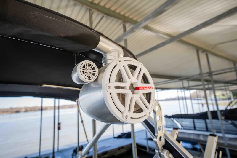 Slide: The Image of Speaker system on a 2010 MasterCraft X25 boat under a covered dock. - 30