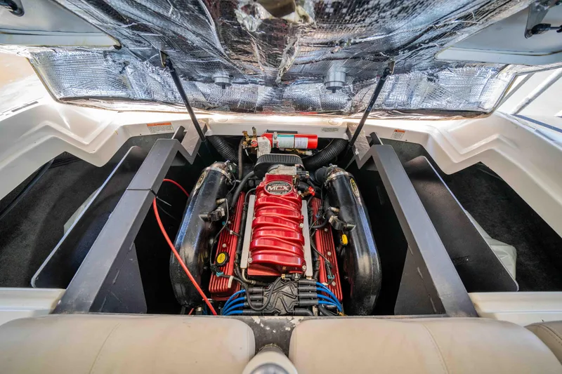 Slide: The Image of Engine compartment of a 2010 MasterCraft X25 boat, featuring a powerful inboard motor. - 33