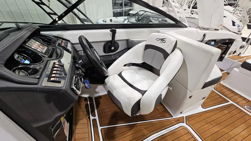 Slide: The Image of 2016 Monterey 258 Super Sport boat interior with steering wheel and captain's seat. - 12
