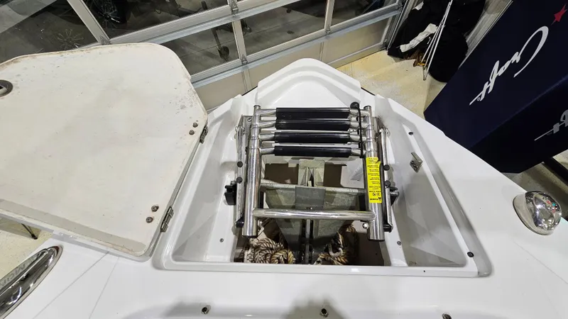 Slide: The Image of 2016 Monterey 258 Super Sport boat with open anchor storage and ladder. - 18