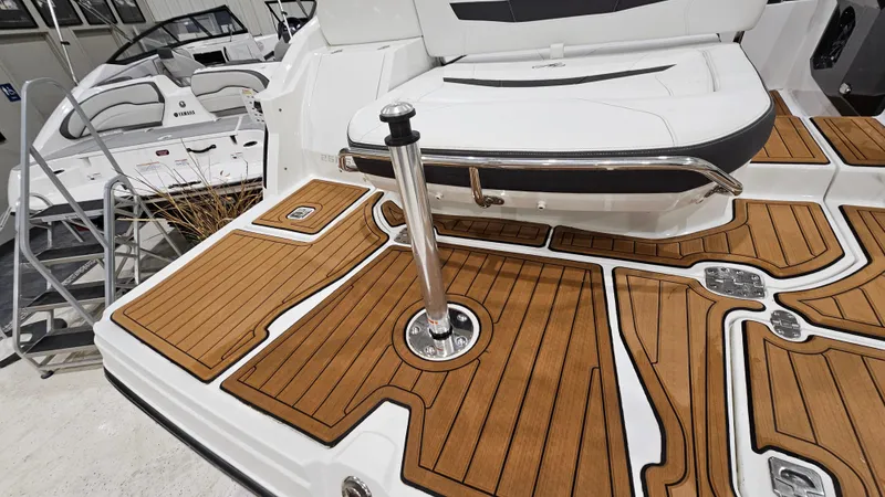Slide: The Image of 2016 Monterey 258 Super Sport boat with teak deck and stainless steel fittings. - 31