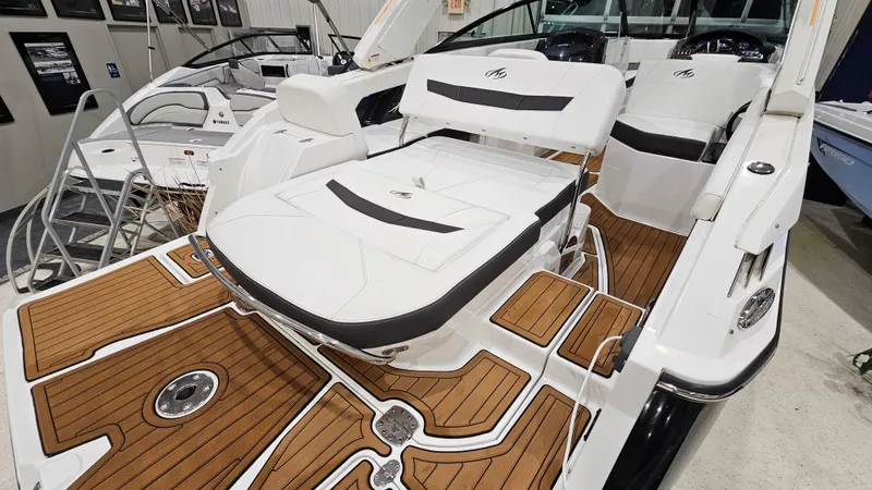 Slide: The Image of 2016 Monterey 258 Super Sport boat with sleek white seating and wood-accented deck. - 4