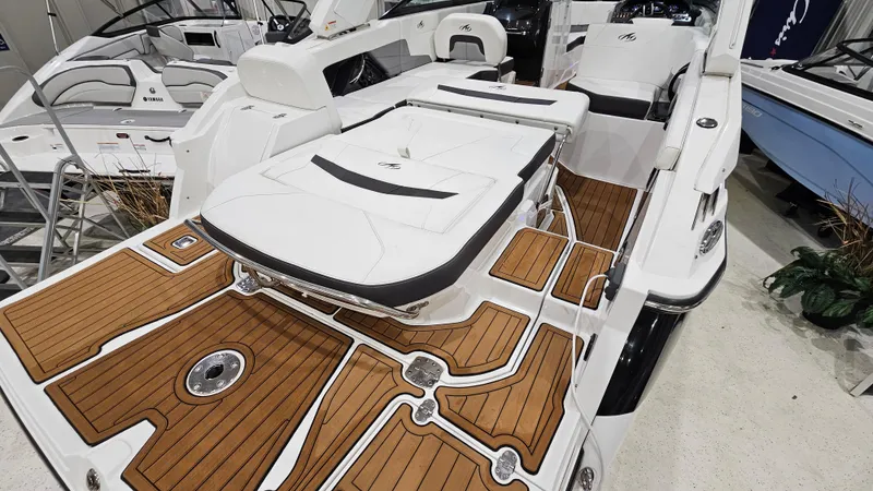 Slide: The Image of 2016 Monterey 258 Super Sport boat with teak deck and white seating. - 5