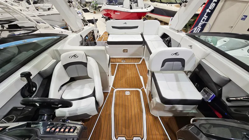 Slide: The Image of 2016 Monterey 258 Super Sport boat interior with sleek seating and wood flooring. - 8