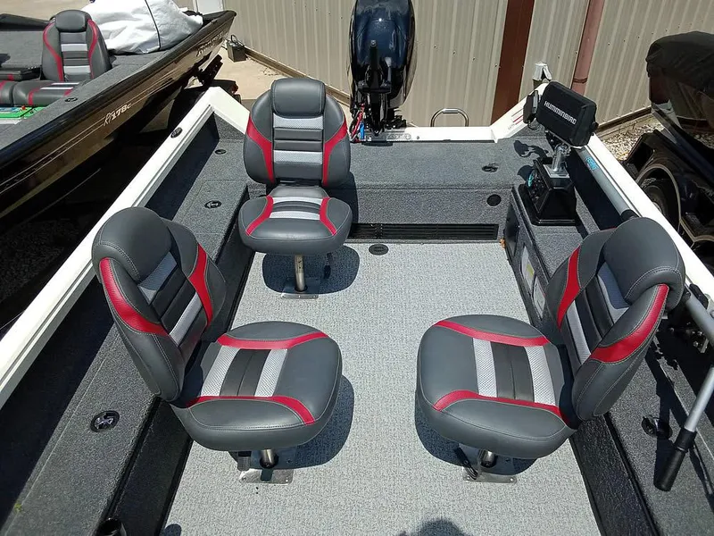 Slide: The Image of 2022 Ranger VS1665T boat interior with four gray and red seats. - 11