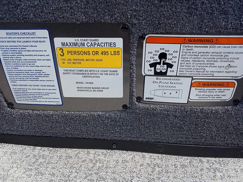 Slide: The Image of 2022 Ranger VS1665T boat capacity and safety warning labels, including maximum weight and carbon monoxide warnings. - 14