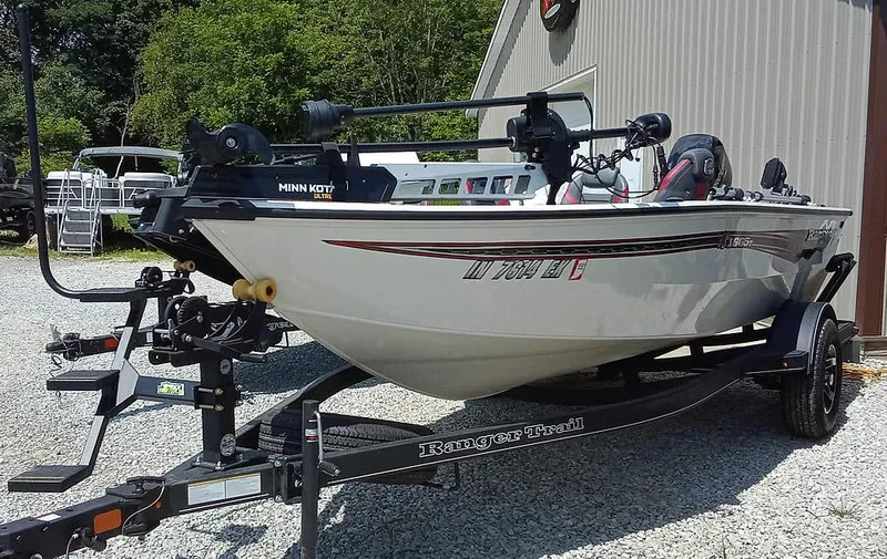 Slide: The Image of 2022 Ranger VS1665T fishing boat on trailer, parked outdoors. - 19