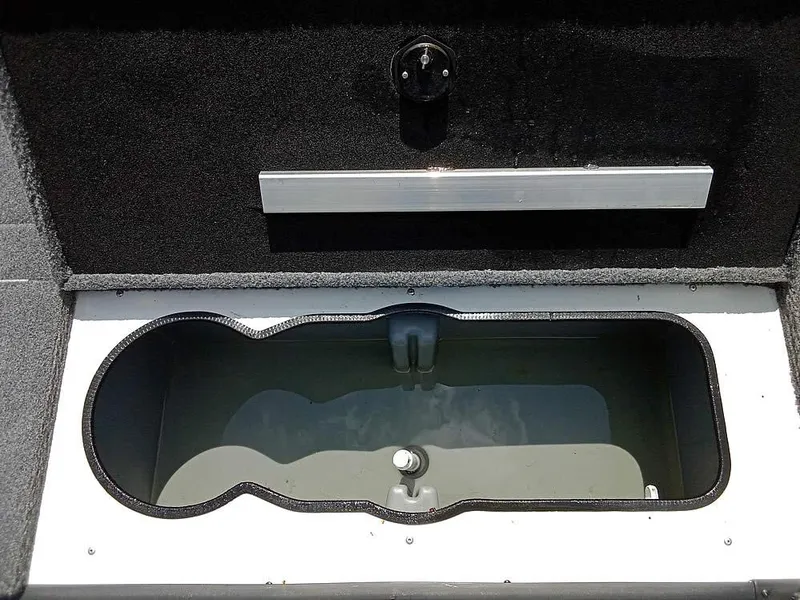 Slide: The Image of 2022 Ranger VS1665T boat livewell with black interior and silver trim. - 9
