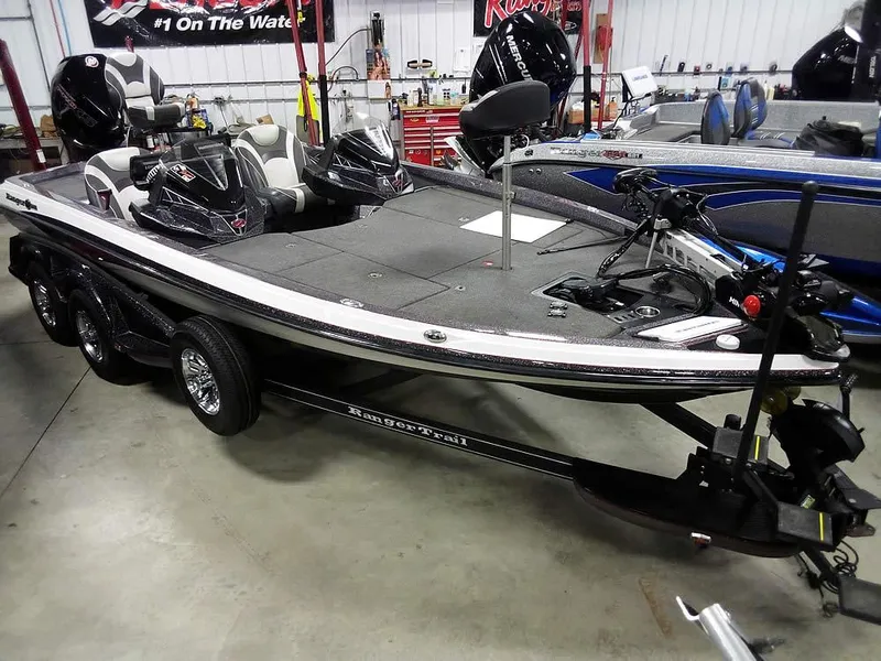 Slide: The Image of 2019 Ranger Z520L Comanche DC boat in showroom, featuring sleek design and advanced fishing equipment. - 1
