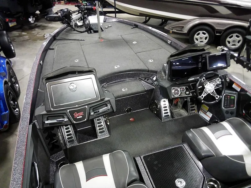 Slide: The Image of 2019 Ranger Z520L Comanche DC boat interior with advanced controls and seating. - 12