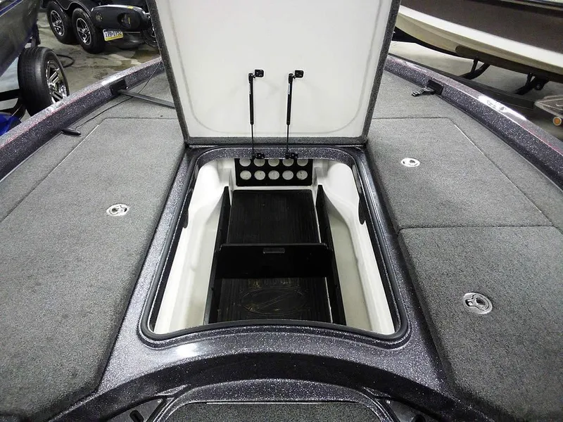 Slide: The Image of 2019 Ranger Z520L Comanche DC boat with open storage compartment, gray interior. - 14