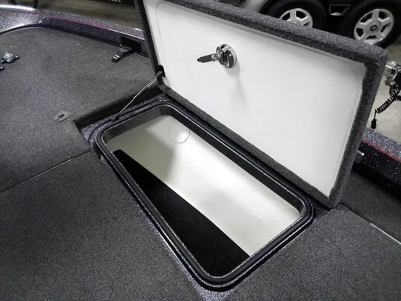 Slide: The Image of 2019 Ranger Z520L Comanche DC boat storage compartment with open lid and key lock. - 17