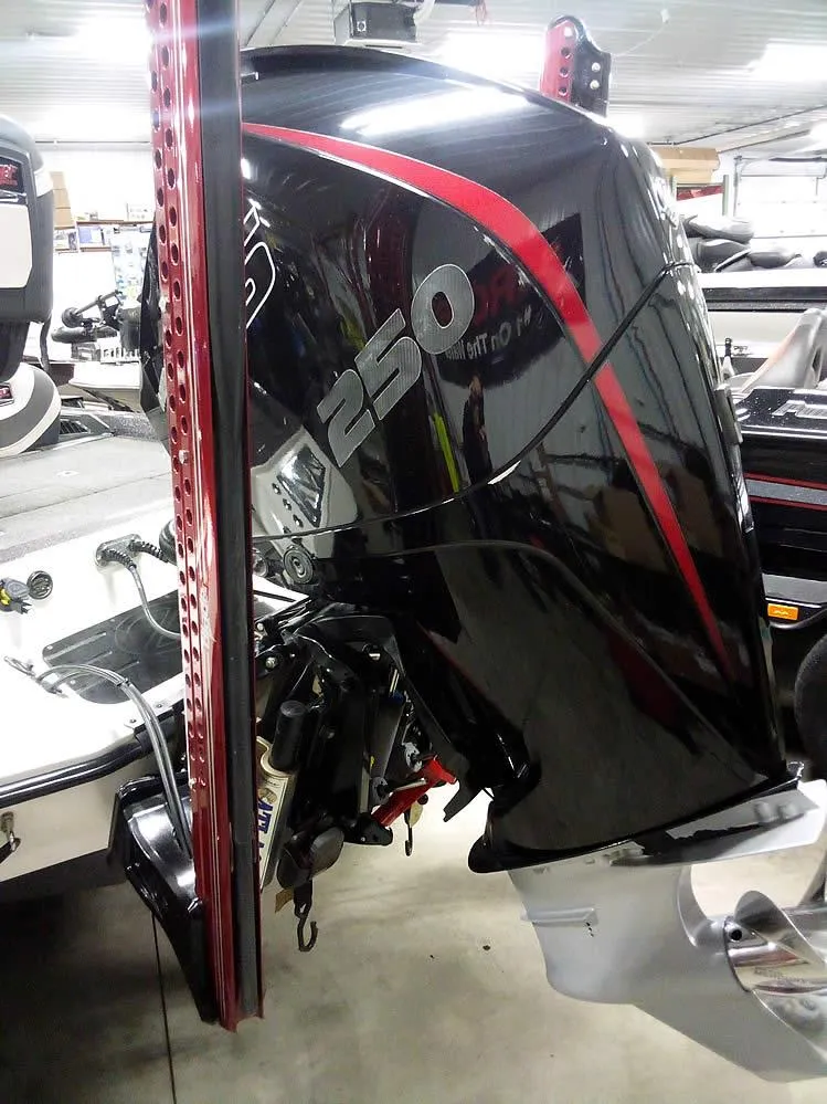 Slide: The Image of 2019 Ranger Z520L Comanche DC with powerful 250 HP outboard motor in a showroom. - 2