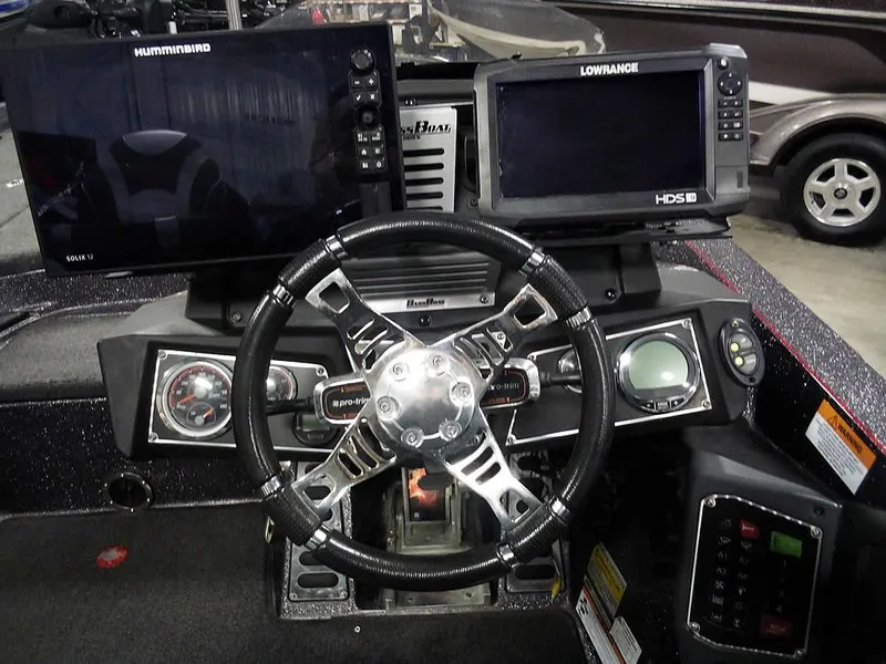 Slide: The Image of 2019 Ranger Z520L Comanche DC boat dashboard with Humminbird and Lowrance displays. - 32