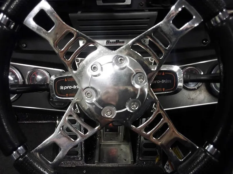 Slide: The Image of Steering wheel of 2019 Ranger Z520L Comanche DC boat with metallic accents and dashboard controls. - 33