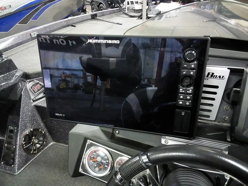 Slide: The Image of 2019 Ranger Z520L Comanche DC boat dashboard with Humminbird Solix 12 fishfinder display. - 35
