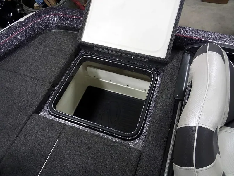 Slide: The Image of 2019 Ranger Z520L Comanche DC boat storage compartment with open lid, gray interior. - 38