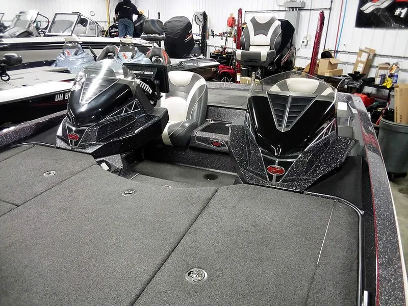 Slide: The Image of 2019 Ranger Z520L Comanche DC boat interior with dual consoles in a showroom. - 9
