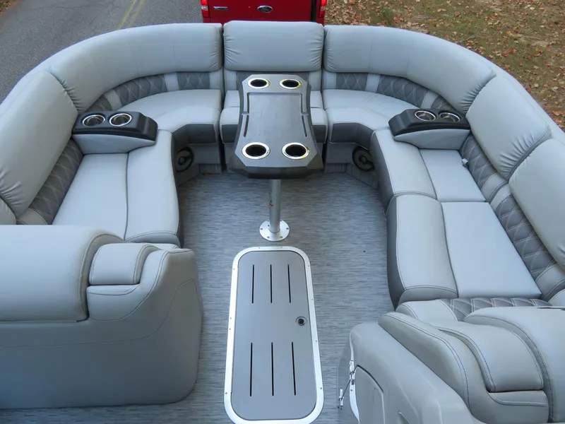 Slide: The Image of Luxurious seating on a 2020 Bennington 25QXSBWAIO pontoon boat with cup holders and table. - 20