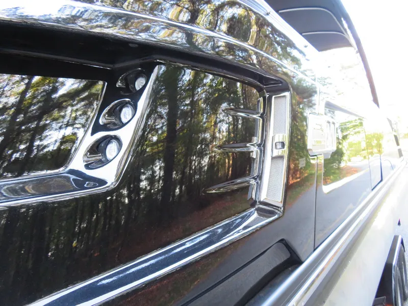 Slide: The Image of Close-up of a 2020 Bennington 25QXSBWAIO boat's sleek, reflective exterior detailing. - 26