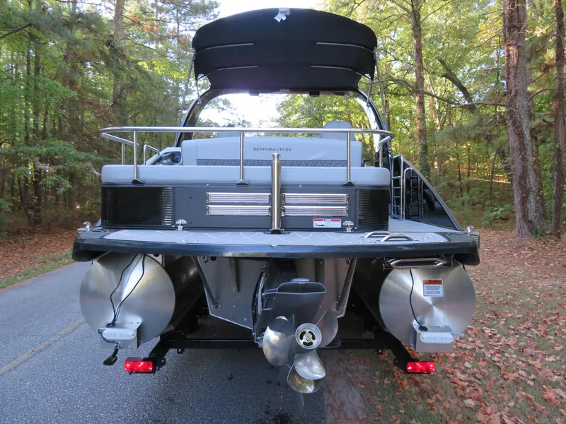 Slide: The Image of 2020 Bennington 25QXSBWAIO pontoon boat on a forest road. - 6