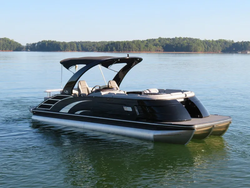 Slide: The Image of 2020 Bennington 25QXSBWAIO pontoon boat on a serene lake. - 8