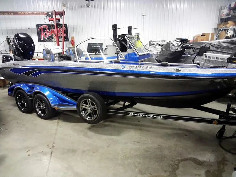 The Image of 2018 Ranger 621FS Fisherman boat in showroom, featuring sleek design and blue accents. - 0