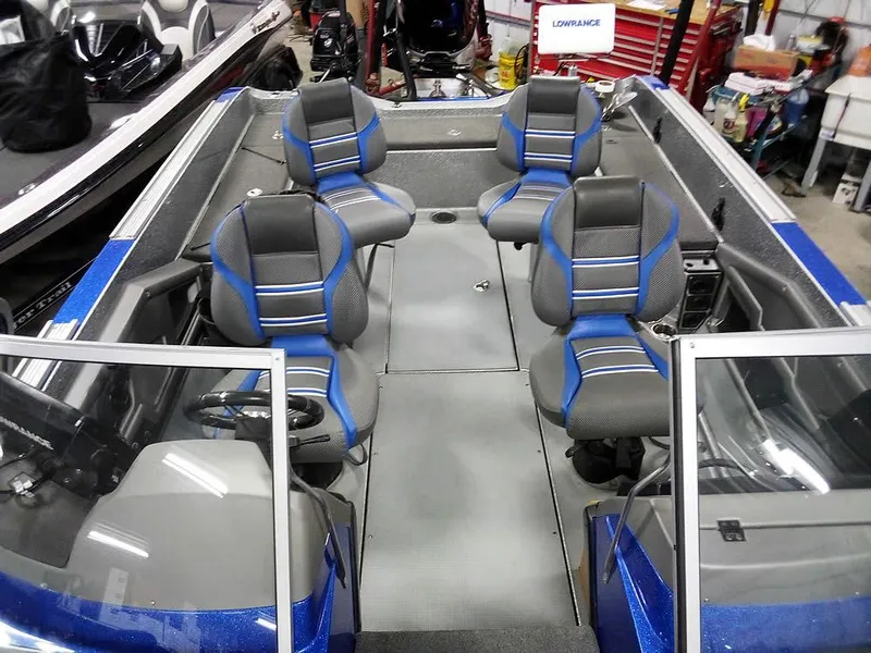 Slide: The Image of 2018 Ranger 621FS Fisherman boat interior with blue and gray seating. - 13
