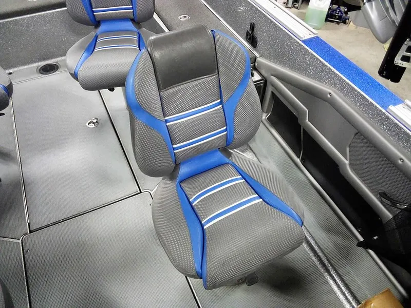 Slide: The Image of 2018 Ranger 621FS Fisherman boat interior with blue and gray seating. - 14