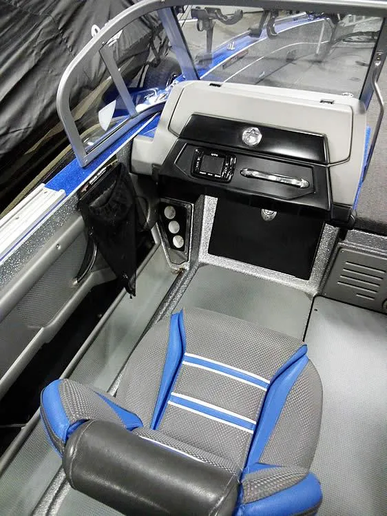 Slide: The Image of 2018 Ranger 621FS Fisherman boat interior with blue and gray seating and control panel. - 15