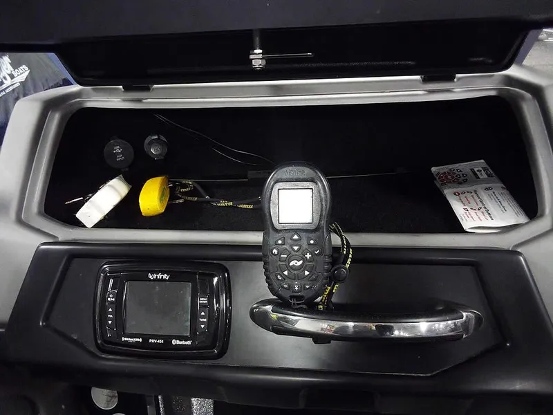 Slide: The Image of 2018 Ranger 621FS Fisherman dashboard with radio, controls, and storage compartment. - 18