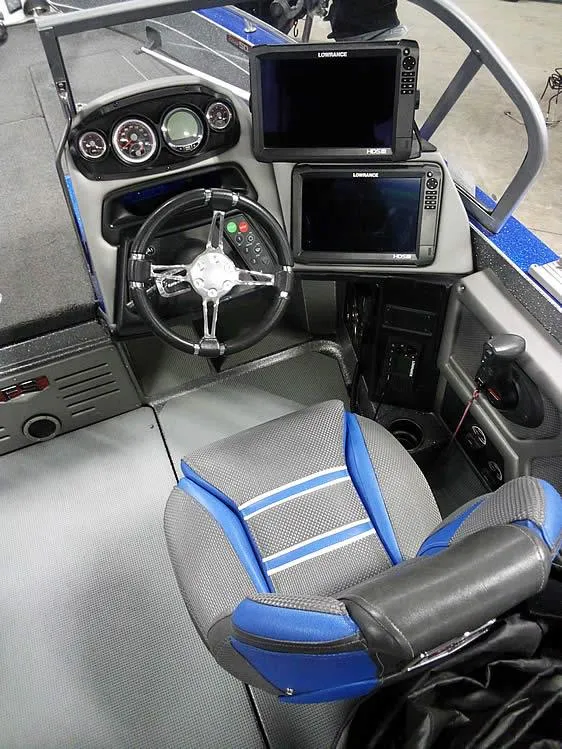 Slide: The Image of 2018 Ranger 621FS Fisherman boat cockpit with steering wheel and navigation screens. - 21