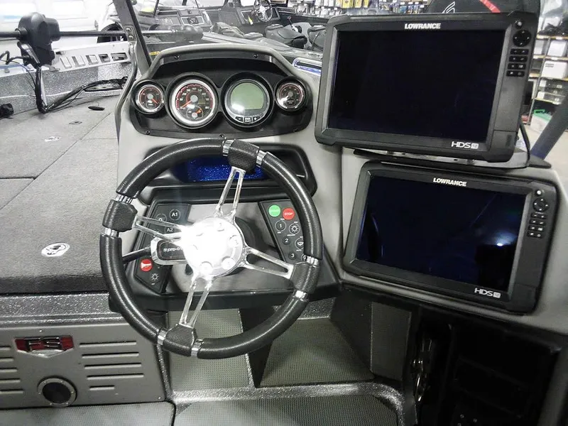 Slide: The Image of 2018 Ranger 621FS Fisherman boat dashboard with steering wheel and Lowrance displays. - 22