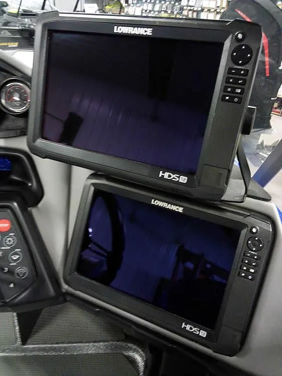 Slide: The Image of Dual Lowrance HDS displays in a 2018 Ranger 621FS Fisherman boat cockpit. - 23